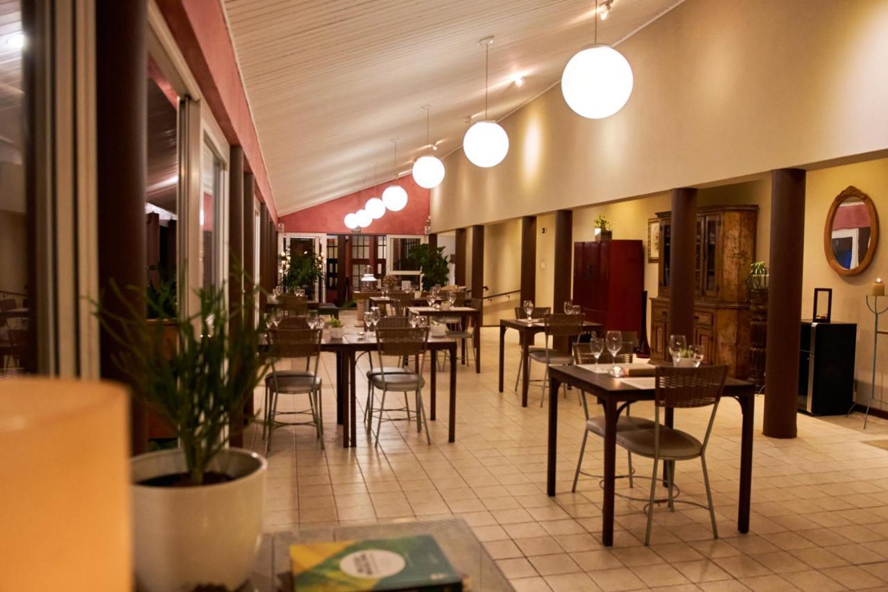 Hotel Boutique Frangipani Brotas Buitenkant foto Restaurant